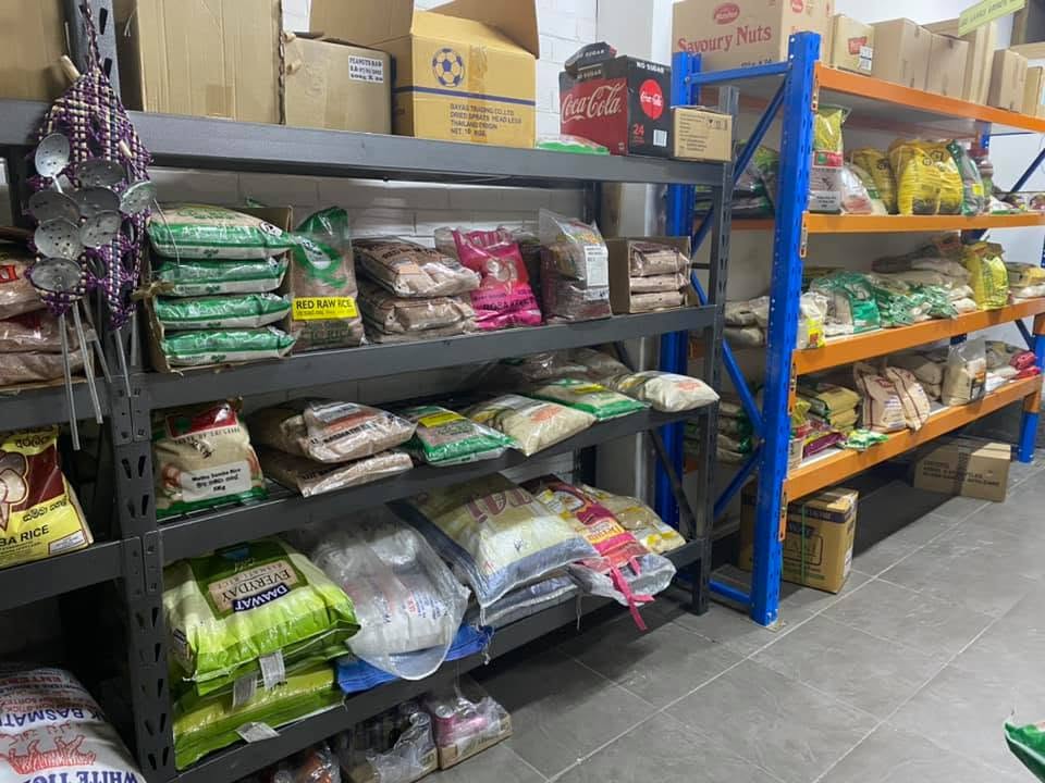 Shelves stocked with rice and grocery staples inside Taprobane Srilankan Grocery